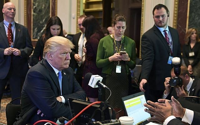 US President Donald Trump sits for a radio interview in the Eisenhower Executive Office Building in the White House complex in Washington, Tuesday, Oct. 17, 2017. (AP Photo/Susan Walsh) US President Donald Trump sits for a radio interview in the Eisenhower Executive Office Building in the White House complex in Washington, Tuesday, Oct. 17, 2017. (AP Photo/Susan Walsh)