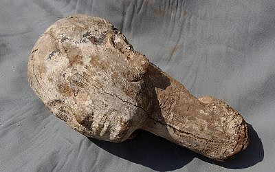 This undated photo released by the Egyptian Ministry of Antiquities shows a wooden head believed to depict Ankhesenpepi II, the mother of King Pepi II of the 6th dynasty who ascended to the throne at the age of six, that was was found in the district of Saqqara, near the ancient Pyramids of Giza during excavation work, the Egyptian the Antiquities Ministry said Wednesday, Oct. 18, 2017. (Egyptian Ministry of Antiquities via AP)