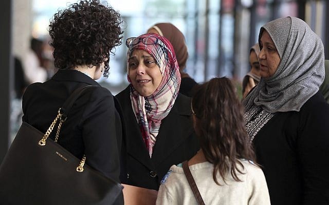 Supporters of Abdella Ahmad Tounisi leave the Dirksen US Courthouse in Chicago on October 19, 2017, after Tounisi was sentenced to 15 years in prison. (Terrence Antonio James/Chicago Tribune via AP) Supporters of Abdella Ahmad Tounisi leave the Dirksen US Courthouse in Chicago on October 19, 2017, after Tounisi was sentenced to 15 years in prison. (Terrence Antonio James/Chicago Tribune via AP)