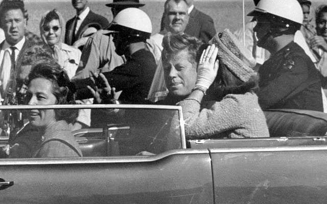 President John F. Kennedy waves from his car in a motorcade in Dallas moments before his assassination, November 22, 1963. (AP/Jim Altgens, File) President John F. Kennedy waves from his car in a motorcade in Dallas moments before his assassination, November 22, 1963. (AP/Jim Altgens, File)