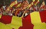 Nationalist activists protest with Spanish and Catalan flags during a mass rally against Catalonia's declaration of independence, in Barcelona, Spain, on October 29, 2017. (AP Photo/Santi Palacios)