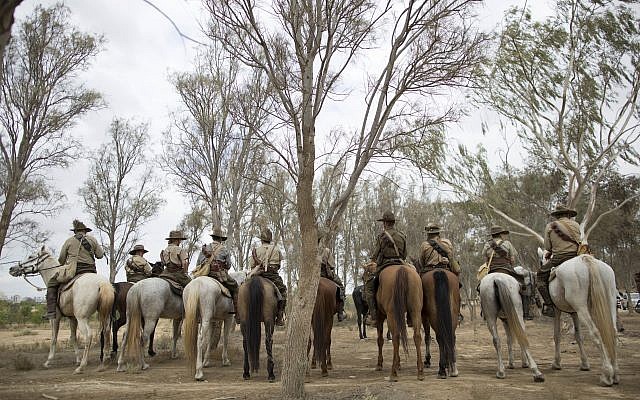 History enthusiasts and descendants of Australian Mounted Division and ANZAC (Australian and New Zealand Mounted Division) Mounted Division soldiers ride their horses during the reenactment of the Battle of Beersheba when British and ANZAC forces captured Beersheba from the Ottoman Empire during the World War I, as part of the 100 years anniversary in near Beersheba, southern Israel, Monday, Oct. 30, 2017. (AP Photo/Oded Balilty)