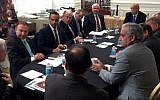 In this photo from US President Donald Trump's Twitter account, George Papadopoulos, third from left, sits at a table with then-candidate Trump and others at what is labeled as a national security meeting in Washington that was posted on March 31, 2016. (Donald Trump's Twitter account via AP)