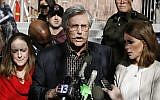 Fred Goldman, center, father of Ron Goldman, who was murdered in 1994, speaks to reporters after O.J. Simpson's sentencing hearing outside the Clark County Regional Justice Center in Las Vegas,  December 5, 2008. (AP Photo/Isaac Brekken, Pool)