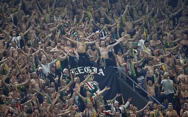 Legia fans during a Europa League match between Ajax and Legia at the Amsterdam ArenA stadium in Amsterdam, Netherlands, Thursday, February 23, 2017. (AP Photo/Peter Dejong) Legia fans during a Europa League match between Ajax and Legia at the Amsterdam ArenA stadium in Amsterdam, Netherlands, Thursday, February 23, 2017. (AP Photo/Peter Dejong)