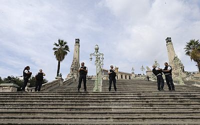 French police officers block access to Marseille's main train station, Sunday, Oct. 1, 2017. French police have warned people to avoid Marseille's main train station following a knife attack in which two people and the attacker were killed. (AP Photo/Claude Paris)