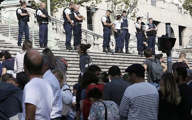 Passengers wait in front a line a police officers blocking the access to Marseille's main train station Sunday, Oct. 1, 2017 in Marseille, southern France. French police have warned people to avoid Marseille's main train station following a knife attack in which two people and the attacker were killed. (AP Photo/Claude Paris) Passengers wait in front a line a police officers blocking the access to Marseille's main train station Sunday, Oct. 1, 2017 in Marseille, southern France. French police have warned people to avoid Marseille's main train station following a knife attack in which two people and the attacker were killed. (AP Photo/Claude Paris)