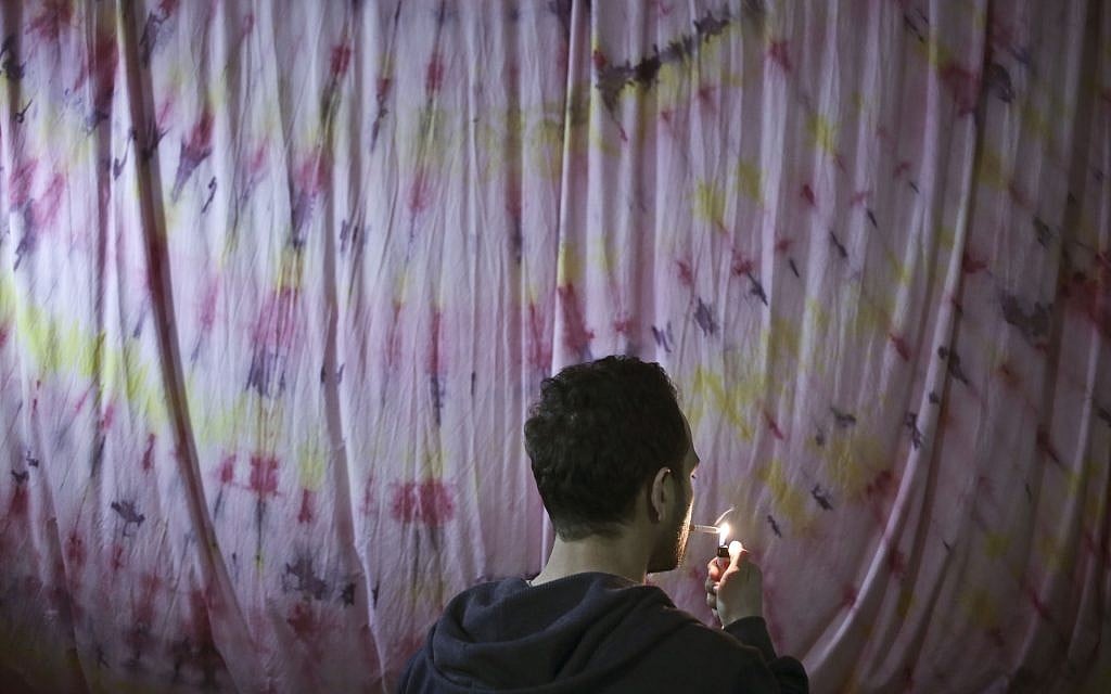 A gay Egyptian man lights a cigarette in Cairo, Egypt, on Thursday, December 11, 2014 (AP Photo/Nariman El-Mofty)
