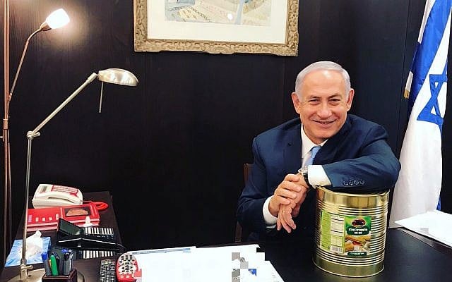 Prime Minister Benjamin Netanyahu poses with a large can of pickles on October 23, 2017. (Courtesy: Prime Minister's Office) Prime Minister Benjamin Netanyahu poses with a large can of pickles on October 23, 2017. (Courtesy: Prime Minister's Office)