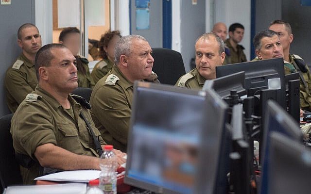 From left, Southern Command chief Maj. Gen. Eyal Zamir, IDF Chief of Staff Gadi Eisenkot, Gaza Division commander Brig. Gen. Yehuda Fuchs and Coordinator of the Government's Activities in the Territories Maj. Gen. Yoav Mordechai hold a situational assessment meeting near the Gaza border on October 31, 2017. (Israel Defense Forces) From left, Southern Command chief Maj. Gen. Eyal Zamir, IDF Chief of Staff Gadi Eisenkot, Gaza Division commander Brig. Gen. Yehuda Fuchs and Coordinator of the Government's Activities in the Territories Maj. Gen. Yoav Mordechai hold a situational assessment meeting near the Gaza border on October 31, 2017. (Israel Defense Forces)