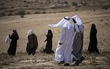 Illustrative: Residents of the unrecognized Bedouin village of Umm al Hiran walk to their homes after a protest against the town's demolition, on August 27, 2015. (Hadas Parush/Flash90)