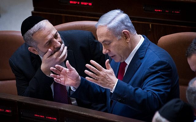 File: Prime Minister Benjamin Netanyahu, right, speaks with Interior Minister Aryeh Deri during a plenum session in the Knesset, January 11, 2016. (Miriam Alster/Flash90) File: Prime Minister Benjamin Netanyahu, right, speaks with Interior Minister Aryeh Deri during a plenum session in the Knesset, January 11, 2016. (Miriam Alster/Flash90)