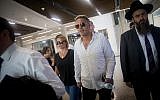 Israeli pop singer Kobi Peretz (C) and his wife arrive for a hearing at the Tel Aviv District Court on June 28, 2017. (Yonatan Sindel/Flash90)