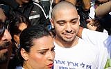 Ex-IDF soldier Elor Azaria is flanked by family and supporters as he arrives to begin his sentence at the military prison in Tzrifin, on August 9, 2017. (Flash90)