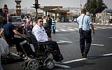 Disabled, handicapped and activists block the entrance to Jerusalem as they attend a protest calling for better health care, September 18, 2017. (Yonatan Sindel/Flash90)