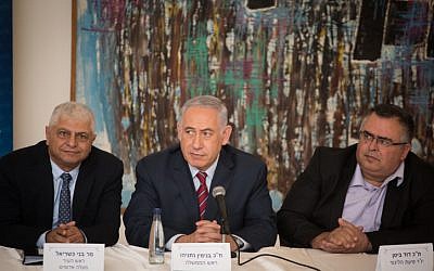 Prime Minister Benjamin Netanyahu (center) with mayor of Ma'ale Adumim Benny Kashriel (right) during a Likud faction meeting in Ma'ale Adumim, near Jerusalem on October 3, 2017. (Hadas Parush/Flash90)