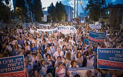 Women from the 'Women Wage Peace' movement at the final part of the peace journey in Jerusalem on October 8, 2017. The peace journey was created in order to pressure decision makers to work towards reaching a viable peace agreement.  (Yonatan Sindel/Flash90)