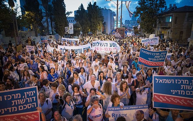 Women from the 'Women Wage Peace' movement at the final part of the peace journey in Jerusalem on October 8, 2017. The peace journey was created in order to pressure decision makers to work towards reaching a viable peace agreement.  (Yonatan Sindel/Flash90)
