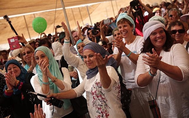 Women from the 'Women Wage Peace' movement take part in a peace march near the Jordan River on Oct 8, 2017. (Flash90)