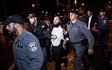 Ultra-Orthodox men clash with police during an anti-draft protest in Jerusalem on October 16, 2017. (Yonatan Sindel/Flash90)