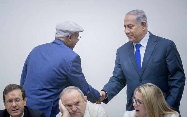 Prime Minister Benjamin Netanyahu (right) shakes hands with Likud MK Avraham Neguise during an event marking Aliya Day in the Knesset on October 24, 2017. (Yonatan Sindel/Flash90) Prime Minister Benjamin Netanyahu (right) shakes hands with Likud MK Avraham Neguise during an event marking Aliya Day in the Knesset on October 24, 2017. (Yonatan Sindel/Flash90)