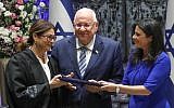 President Reuven Rivlin and Justice Minister Ayelet Shaked stand alongside incoming Supreme Court Chief Justice Esther Hayut  during her swearing in ceremony at the President's Residence in Jerusalem on October 26, 2017. (Miriam Alster/Flash90)