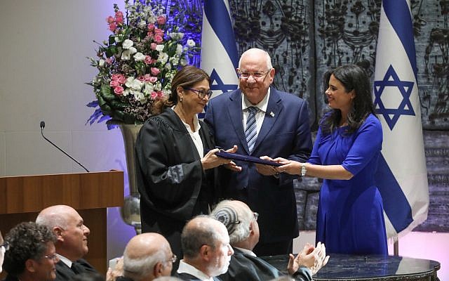 President Reuven Rivlin and Justice Minister Ayelet Shaked stand alongside incoming Supreme Court Chief Justice Esther Hayut  during her swearing in ceremony at the President's Residence in Jerusalem on October 26, 2017. (Miriam Alster/Flash90)