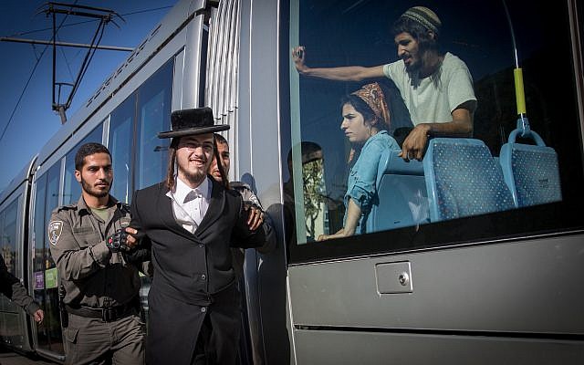 Border policeman arrest an ultra-Orthodox protester during a demonstration against the conscription of ultra-Orthodox Jews to the IDF on October 26, 2017. (Yonatan Sindel/Flash90) Border policeman arrest an ultra-Orthodox protester during a demonstration against the conscription of ultra-Orthodox Jews to the IDF on October 26, 2017. (Yonatan Sindel/Flash90)