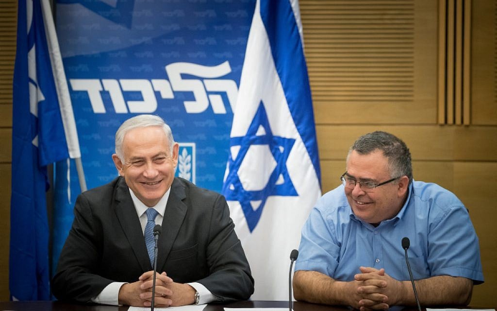 Prime Minister Benjamin Netanyahu, left, with coalition chairman MK David Bitan, right, during a Likud party faction meeting at the Knesset, October 30, 2017. (Yonatan Sindel/Flash90)