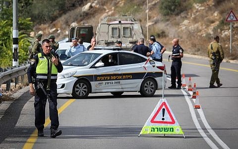Security forces are seen near the West Bank settlement of Halamish, where IDF soldiers shot dead a Palestinian driver who they said accelerated towards them, on October 31, 2017. (Flash90)