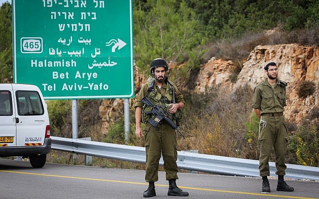 Illustrative: Security forces are seen near the West Bank settlement of Halamish, where IDF soldiers shot dead a Palestinian driver who they said accelerated toward them, on October 31, 2017. (Flash90) Illustrative: Security forces are seen near the West Bank settlement of Halamish, where IDF soldiers shot dead a Palestinian driver who they said accelerated toward them, on October 31, 2017. (Flash90)