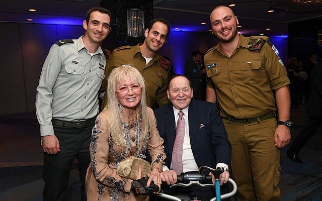 Sheldon and Dr. Miriam Adelson pose for a picture with IDF soldiers at a Friends of the IDF gala in New York on October 23, 2017. (Shahar Azran/FIDF) Sheldon and Dr. Miriam Adelson pose for a picture with IDF soldiers at a Friends of the IDF gala in New York on October 23, 2017. (Shahar Azran/FIDF)