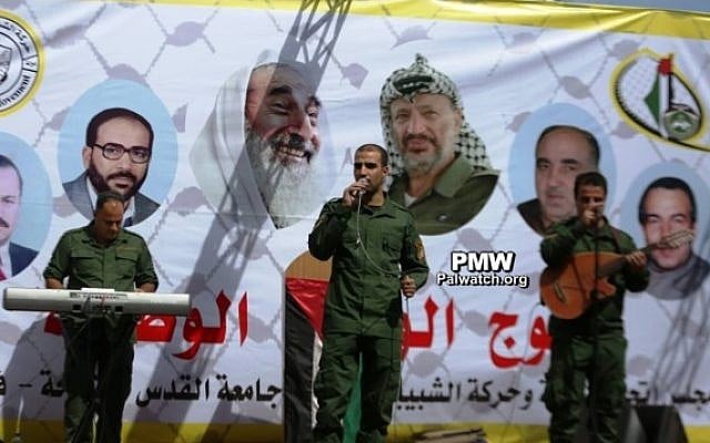 A banner praising Palestinian terrorists as 'heroes' is seen at an Al-Quds University reception for new students on October 15, 2017. (Palestinian Media Watch)