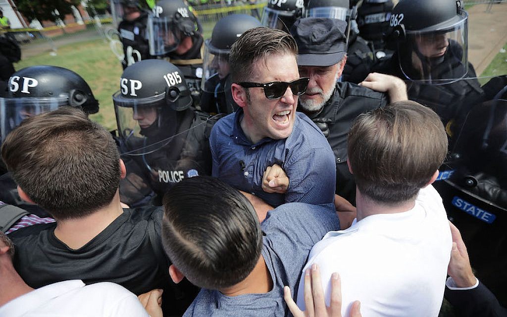 White supremacist leader Richard Spencer, center, and supporters clashing with police after the “Unite the Right” rally in Charlottesville, Virginia., was declared unlawful, August 12, 2017. (Chip Somodevilla/Getty Images) White supremacist leader Richard Spencer, center, and supporters clashing with police after the “Unite the Right” rally in Charlottesville, Virginia., was declared unlawful, August 12, 2017. (Chip Somodevilla/Getty Images)