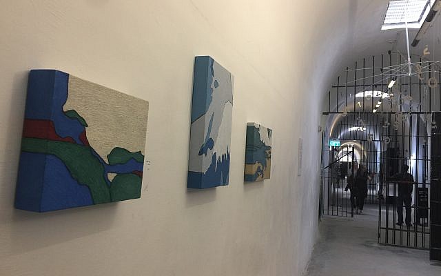 This year's Jerusalem Biennale challenged artists to seek watershed moments in their own history, and in that of the Jewish people; these are some of the works hung in the Underground Prisoners Museum, one of the eight locations of the art exhibitions (Jessica Steinberg/Times of Israel)