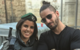 Maluma, right, posing with an Israeli police officer. (Instagram via JTA)