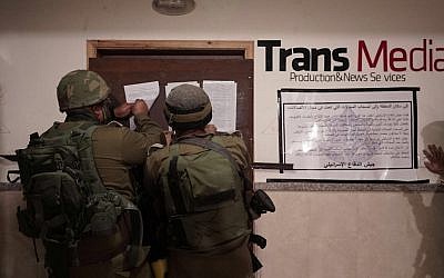 IDF soldiers during a raid at the offices of the Trans Media broadcast company in the West Bank, October 17, 2017. (IDF)