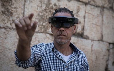 A man takes a look through Augmented Reality glasses at the Innovation Lab event at the Tower of David Museum in Jerusalem's Old City, October 17, 2017. (Hadas Parush/Flash90)