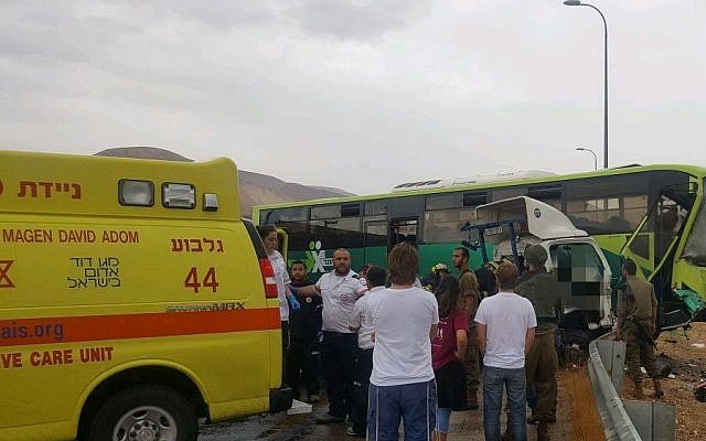 Scene of a car accident between a tow truck and Egged bus on the West Bank's Route 90 on October 9, 2017. (Courtesy: Magen David Adom) Scene of a car accident between a tow truck and Egged bus on the West Bank's Route 90 on October 9, 2017. (Courtesy: Magen David Adom)