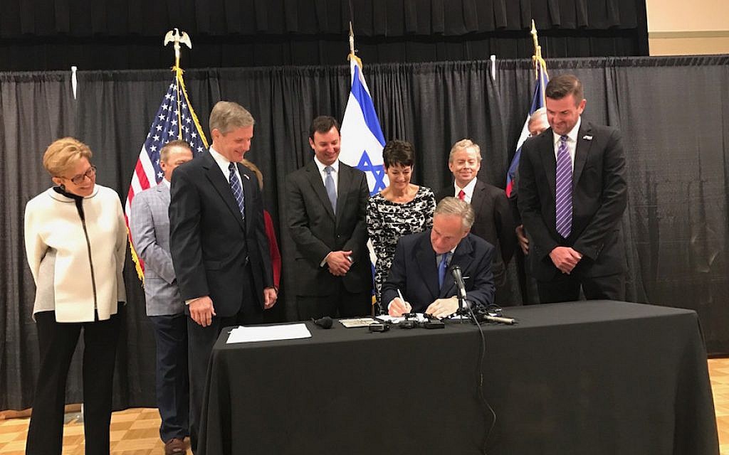 Texas Governor Greg Abbott signing his state’s anti-BDS bill at a Jewish community center in Austin, May 2, 2017. (Office of the Texas Governor) Texas Governor Greg Abbott signing his state’s anti-BDS bill at a Jewish community center in Austin, May 2, 2017. (Office of the Texas Governor)