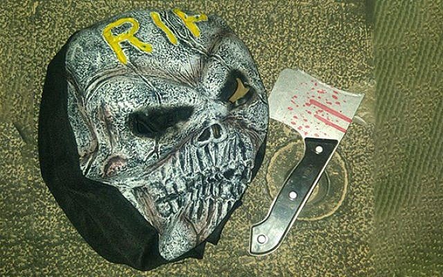 Scary mask and plastic ax confiscated by police from a youth in Jerusalem, October 6, 2017. (Israel Police) Scary mask and plastic ax confiscated by police from a youth in Jerusalem, October 6, 2017. (Israel Police)