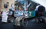 Disabled activists block a road in Jerusalem as part of their campaign for better benefits,  October 9, 2017. (Yonatan Sindel/Flash90)