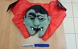 A Dracula mask and knife confiscated from a 13-year-old boy detained by police in the coastal city of Herzliya in a continuing crackdown on youngsters wearing masks to scare the public, October 4, 2017. (Police spokesperson's office)