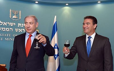 Yossi Cohen, right, head of the Mossad secret service, raises a toast together with Prime Minister Benjamin Netanyahu, ahead of the upcoming Jewish New Year at the PM's office in Jerusalem on September 7, 2015.  (Haim Zach / GPO)