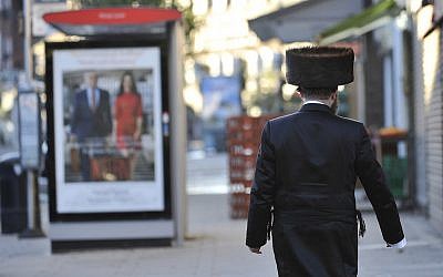 Illustrative: A Jewish man walking in London’s Golders Green neighborhood, which is home to a large Jewish population, September 23, 2015. (Tony Margiocchi/Barcroft Media via Getty Images)