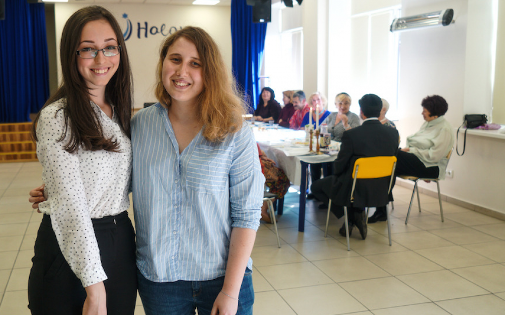 Head of the volunteer department, Alla Shakhova, left, with volunteer Adrianna Golubka, right, at the Halom Jewish Community Center in Kiev, Ukraine, September 8, 2017. (Cnaan Liphshiz/JTA) Head of the volunteer department, Alla Shakhova, left, with volunteer Adrianna Golubka, right, at the Halom Jewish Community Center in Kiev, Ukraine, September 8, 2017. (Cnaan Liphshiz/JTA)