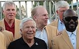 Robert Kraft, center, with Marshall Faulk, right, and, in rear, from left, Ron Yary, Roger Staubach and Dave Casper, June 15, 2017. (Hillel Kuttler via JTA)