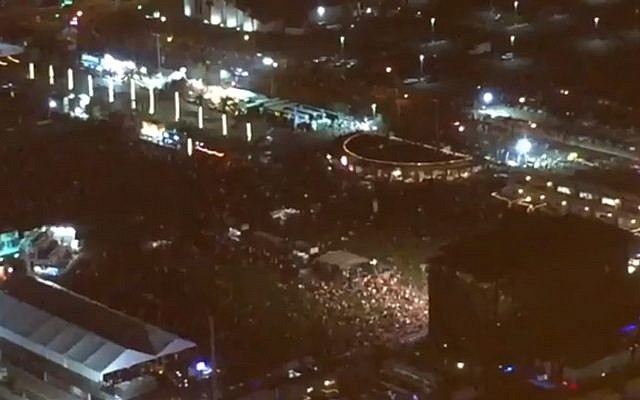 People flee the scene of a shooting in Las Vegas on October 2, 2017. (Screen capture: Twitter) People flee the scene of a shooting in Las Vegas on October 2, 2017. (Screen capture: Twitter)