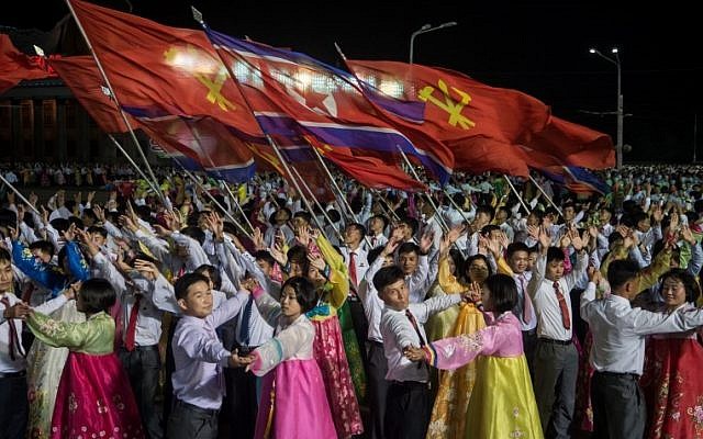 In a photo taken on October 8, 2017, participants described as 'working people, youth, and students of Pyongyang' perform during a mass gala event marking the 20th anniversary of late North Korean leader Kim Jong Il's election as general secretary of the Workers' Party of Korea (WPK) on Kim Il-Sung square in central Pyongyang. (AFP PHOTO / KIM Won-Jin) In a photo taken on October 8, 2017, participants described as 'working people, youth, and students of Pyongyang' perform during a mass gala event marking the 20th anniversary of late North Korean leader Kim Jong Il's election as general secretary of the Workers' Party of Korea (WPK) on Kim Il-Sung square in central Pyongyang. (AFP PHOTO / KIM Won-Jin)