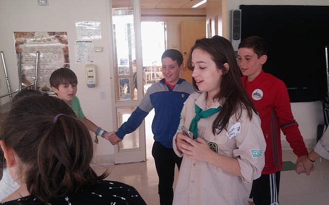 Arielle Geismar, in the Scouting uniform, leading American Jewish kids in one of the first meetings of the Manhattan chapter of Tzofim Atid, the Israeli Scouts’ English-language branch. (Ben Sales)